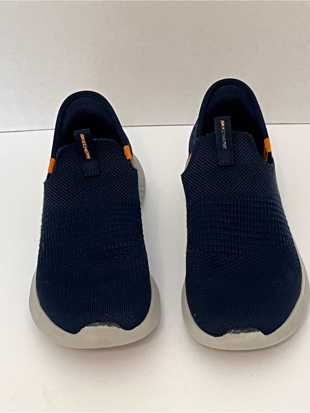 Skechers Navy Slip-On Knit Loafers with Orange Accents